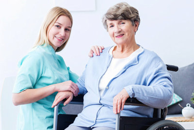 caregiver and her patient smiling